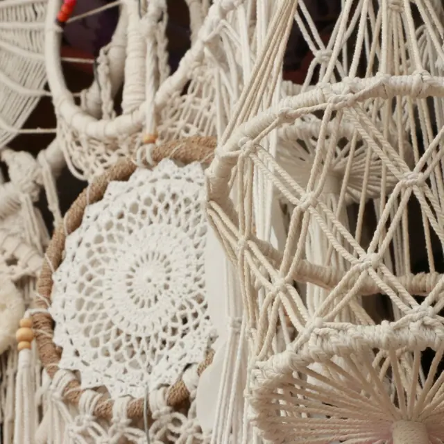 Cream macramé dreamcatcher with crocheted lace centre